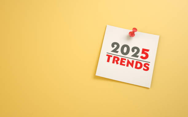 istock 2025 New Year Trends Text Written on Note Paper Sitting on Yellow Background 2190706127