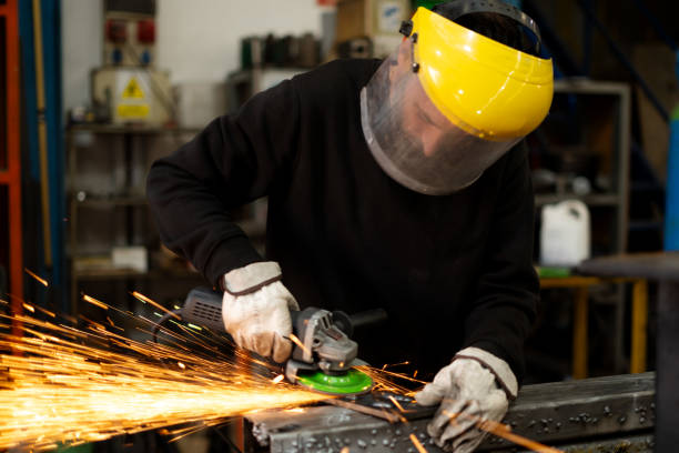 istock man working welded metal with a machine releasing many sparks 2190706180