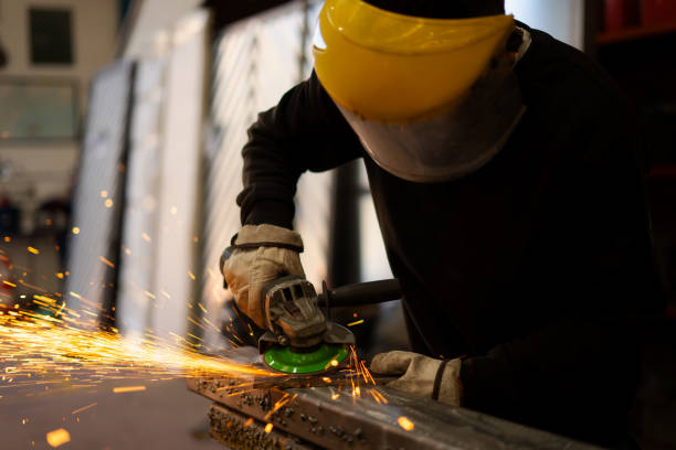 istock metal industry worker man working with irons 2190706198