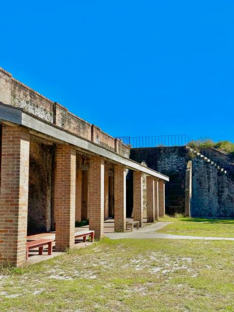 istock Brick Columns and Sunlit Courtyard at Fort Pickens 2190706606