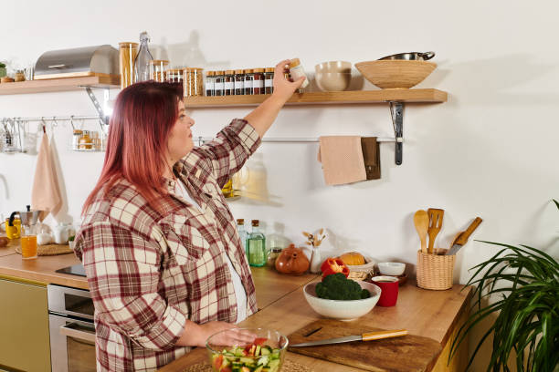 istock Bright modern kitchen setting with a body positive woman preparing healthy snacks 2190706709
