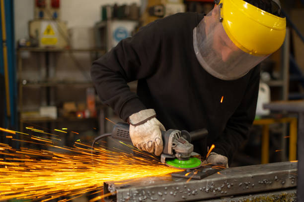 istock man with all safety protections working with iron 2190710354
