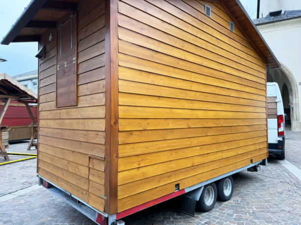 istock Mobile wooden tiny house on trailer in urban setting 2190712121