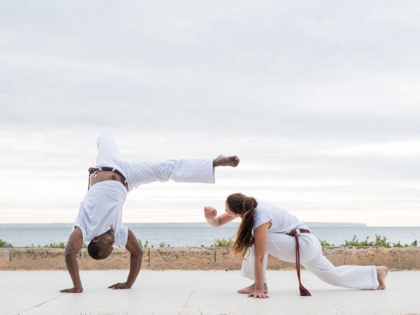 istock A couple doing capoeira exercise near an ocean view 2190712211