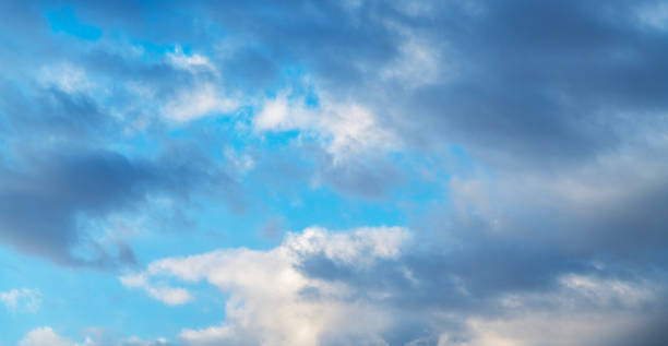 istock Sunset sky background. Beautiful bright sunset sky with clouds. 2190714688