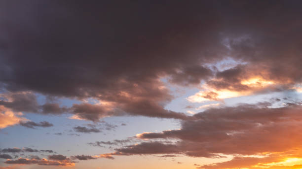 istock Sunset sky background. Beautiful bright sunset sky with clouds. 2190714838