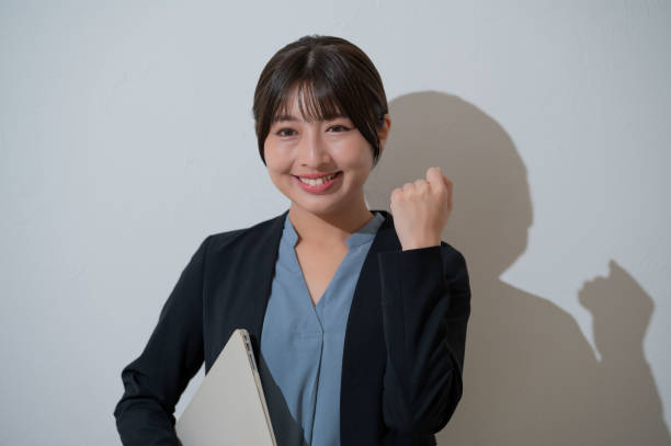 istock A Japanese woman posing with guts on a white background 2190714903