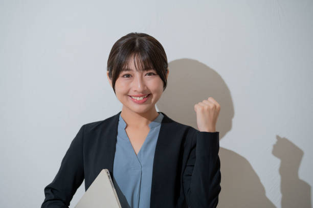 istock A Japanese woman posing with guts on a white background 2190714917
