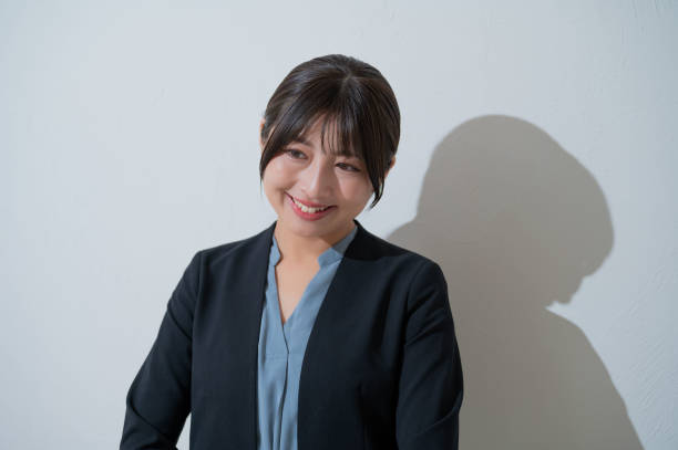 istock A woman smiling on a white background 2190715016