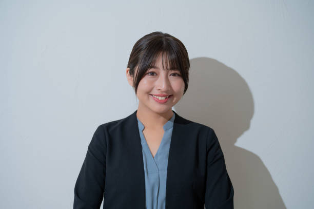 istock A woman smiling on a white background 2190715046