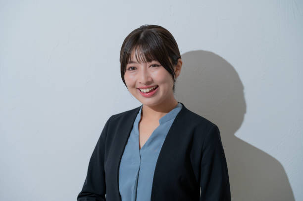 istock A Japanese woman smiling on a white background 2190715158