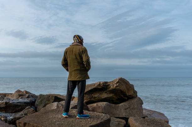 istock Man looking at the sea 2190716368