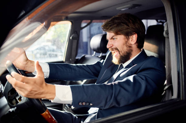 istock bearded man Driving a car trip luxury lifestyle rich 2190716555