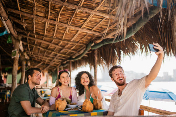 istock Friends taking a selfie in restaurant on the beach 2190716969