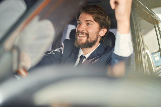 istock bearded man Driving a car trip luxury lifestyle self confidence 2190718252