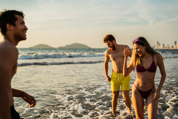 istock Friends celebrating on the beach 2190718524