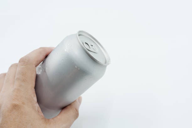 istock hand holding silver aluminum can with condensation on white background 2190718543