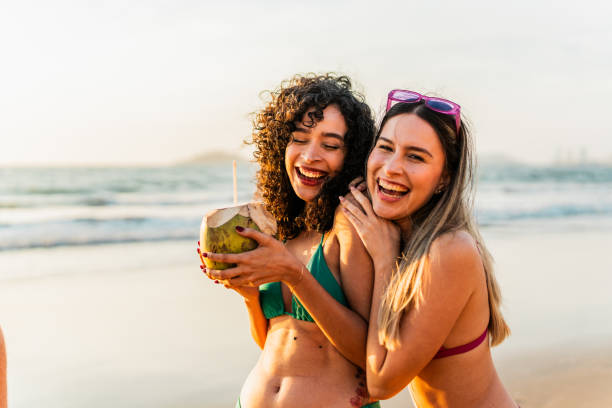 istock Young friends woman talking on the beach 2190718664