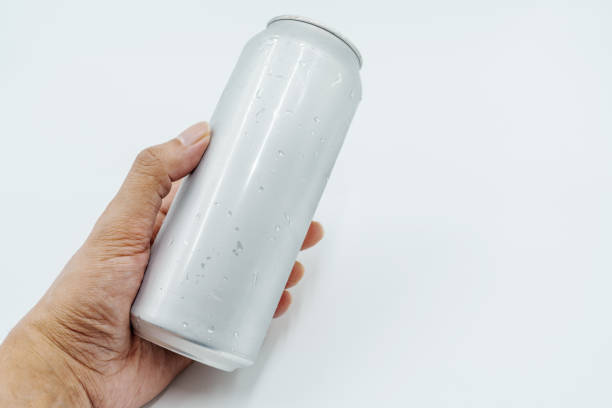 istock hand holding silver can with water droplets, ideal for beverage ads 2190718856