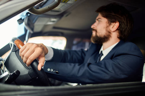 istock bearded man in a suit in a car a trip to work success service rich 2190719331