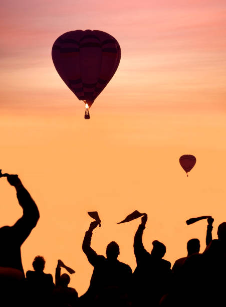A glowing hot air balloon in the early morning sky
