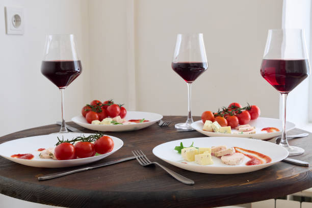 istock A Beautifully Elegant Dinner Table Setting Complete with Fine Wine and Gourmet Dishes 2190721721