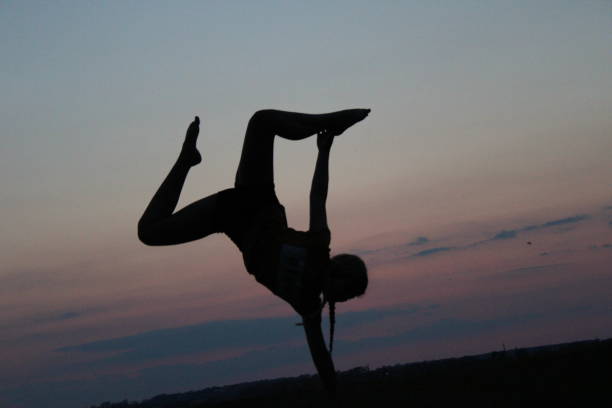 istock Balance and yoga at sunset 2190724214