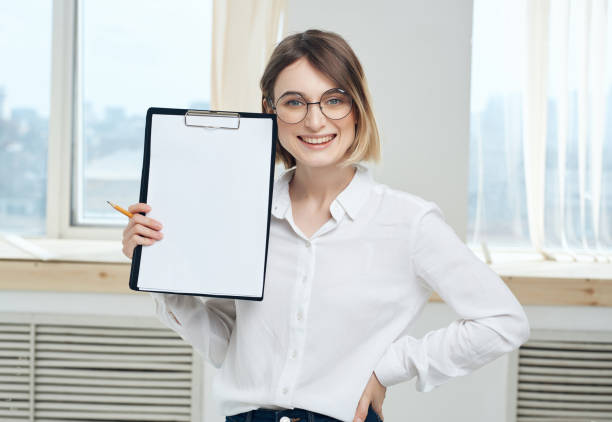 istock Business woman in glasses in white shirt documents Copy Space 2190724309