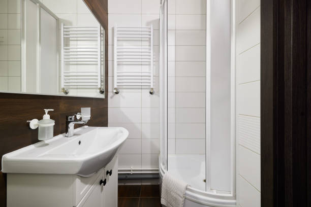 istock A modern bathroom interior featuring a stylish shower and a sleek, contemporary sink design 2190725515