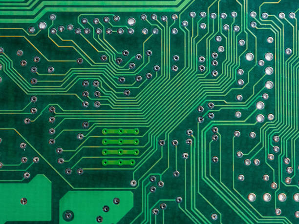 istock Close-up of a printed circuit board with chips, showing the complex connections and electronics parts 2190728669