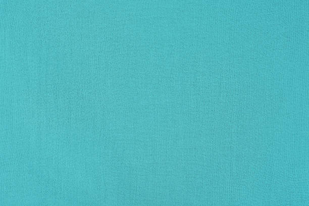 istock Turquoise fabric as a background. Dyed fabric macro photo. 2190729496
