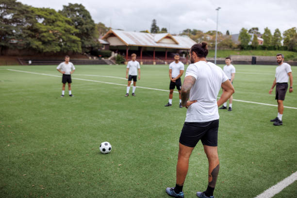 istock Soccer players practicing on soccer field 2190730335