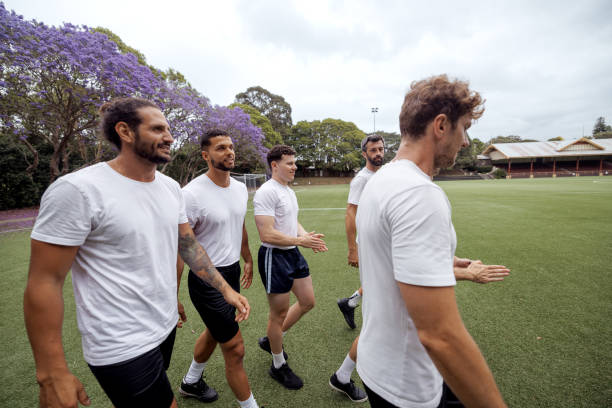 istock Soccer players walking on soccer field after a workout 2190730498