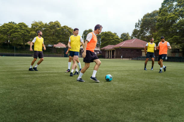 istock Soccer players training on the field 2190730501