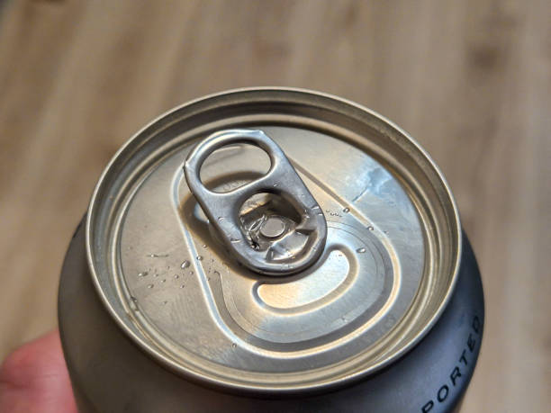 istock Close-up of a can top with a pull tab, displaying droplets of condensation. Perfect for beverage and can design concepts. 2190733755