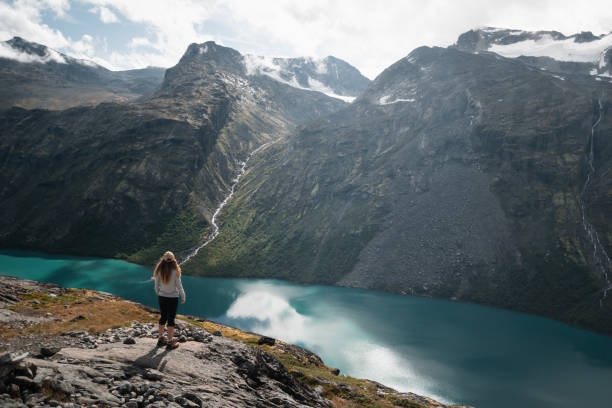 istock Trekking Adventure Overlooking Turquoise Lake and Norwegian Peaks 2190734308