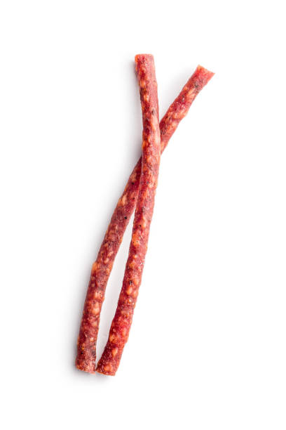 istock Smoked kabanos. Mini dried thin sausages isolated on white background 2190736941