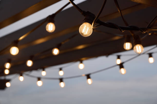 Enhance your outdoor gatherings with festive string lights that create a cozy evening ambiance