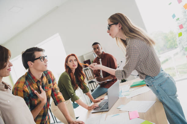 istock Photo of pretty young colleagues problem argument irritated startup project team coworking successful nice light office 2190739910
