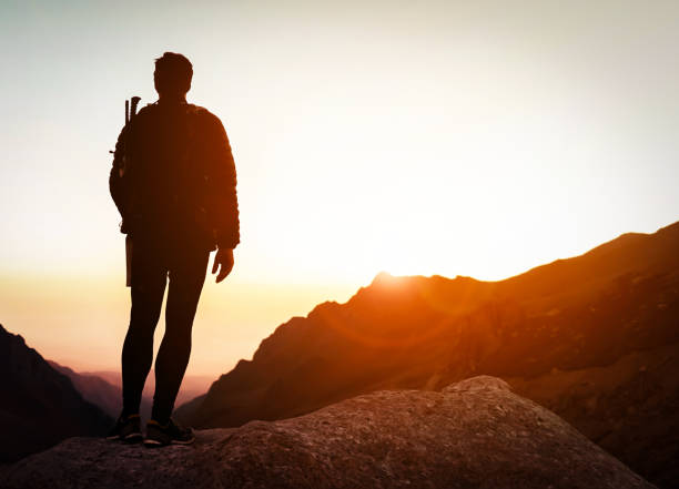 istock Man is climbing, hiking in the mountains. 2190740363