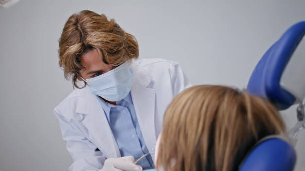 istock Professional checking child teeth wearing mask in dentistry clinic closeup. 2190742185