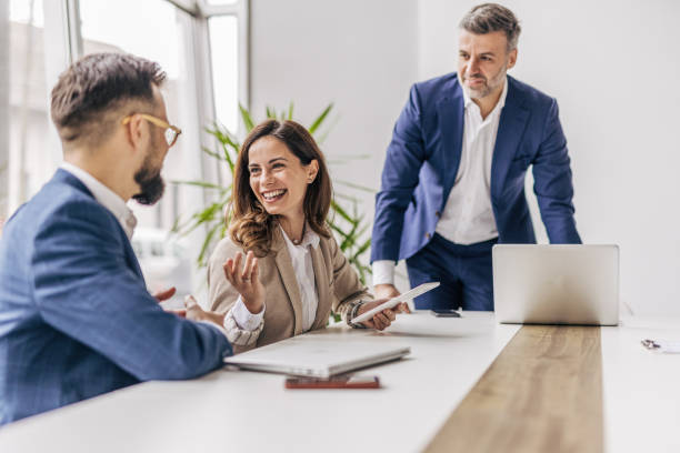 istock Businessman talking with colleagues in meeting 2190743961