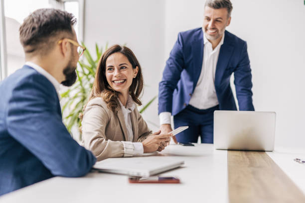istock Businessman talking with colleagues in meeting 2190743983
