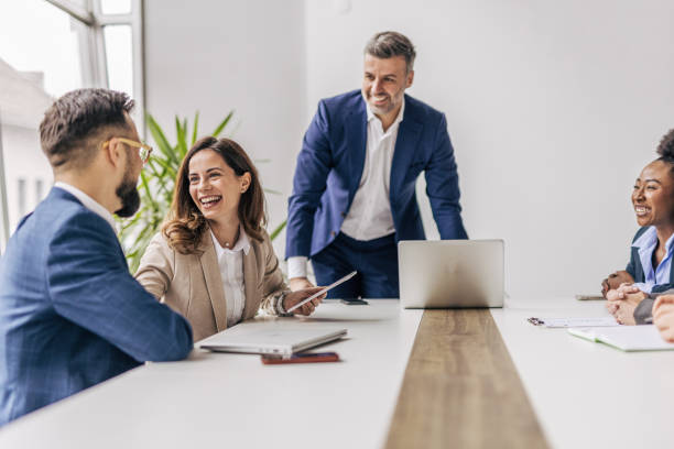 istock Businessman talking with colleagues in meeting 2190744095