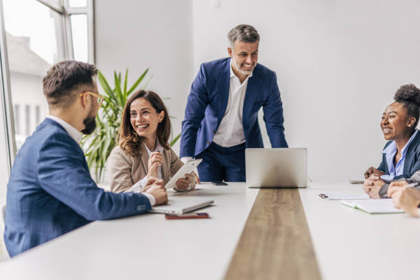istock Businessman talking with colleagues in meeting 2190744170