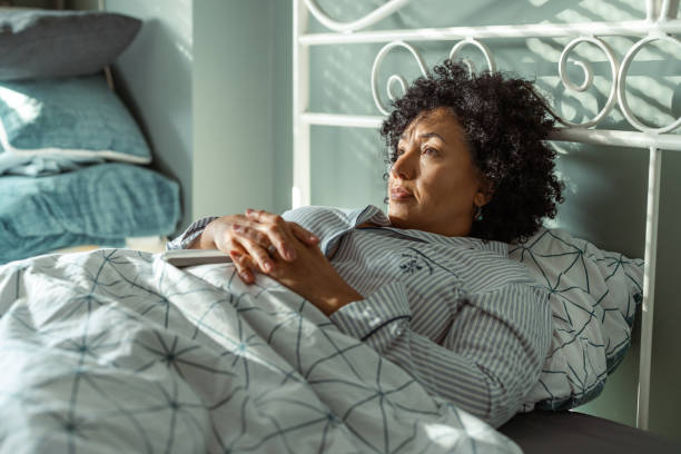 istock Woman resting thoughtfully in bed during a calm morning atmosphere 2190744840