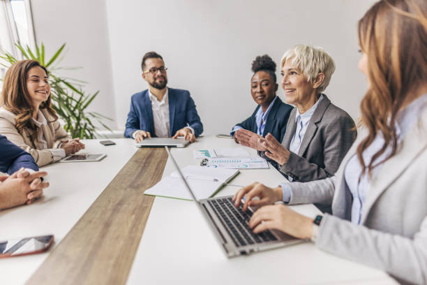 istock Group of business persons working together 2190745734