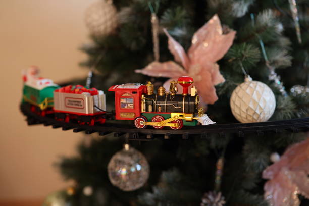 istock A Beautiful Festive Train Ornament Decorated Around a Vibrant Christmas Tree This Holiday Season 2190746688