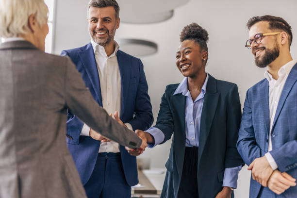 istock Business people shaking hands in the office 2190747231