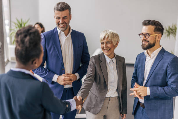 istock Business people shaking hands in the office 2190747235
